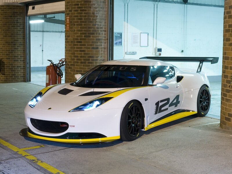 White Lotus race car in garage