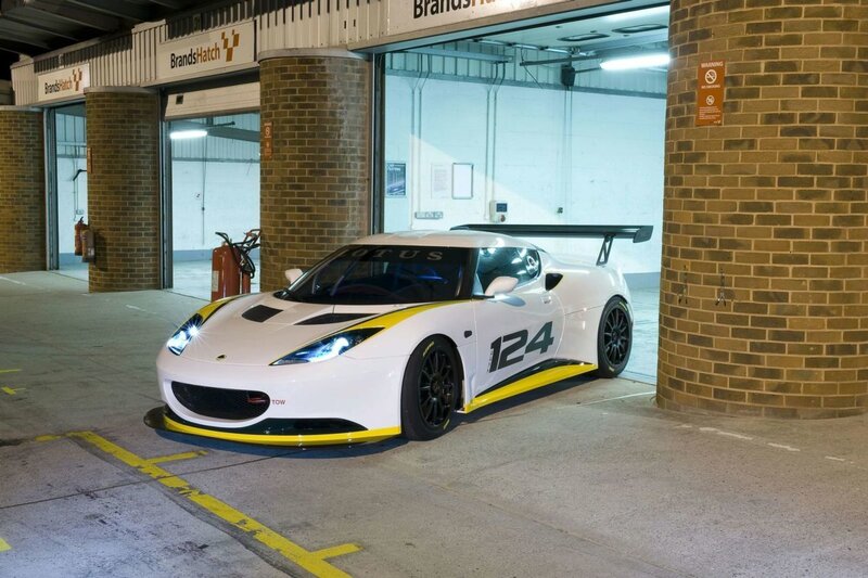 White Lotus race car in garage
