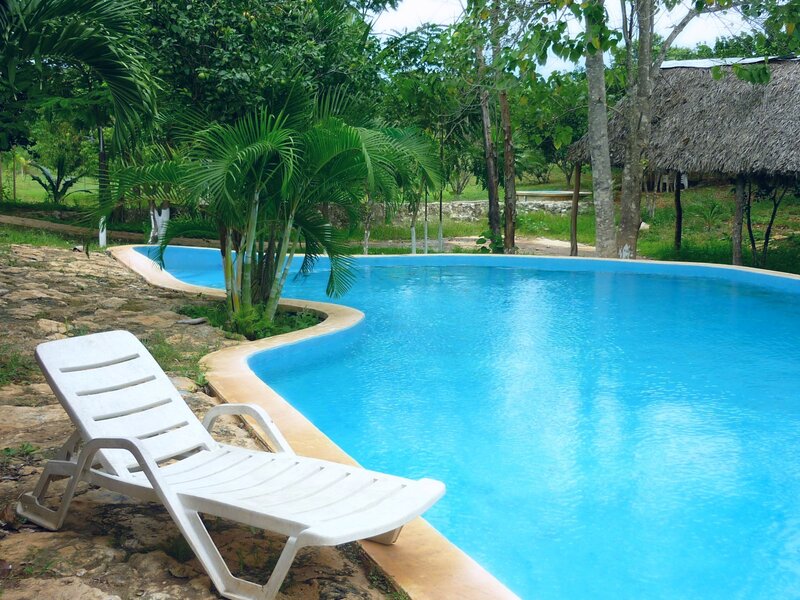White Lounge Chair by Pool