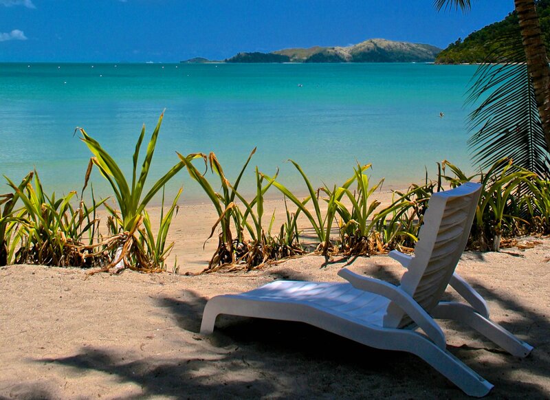 White Lounge Chair on Beach — Blue