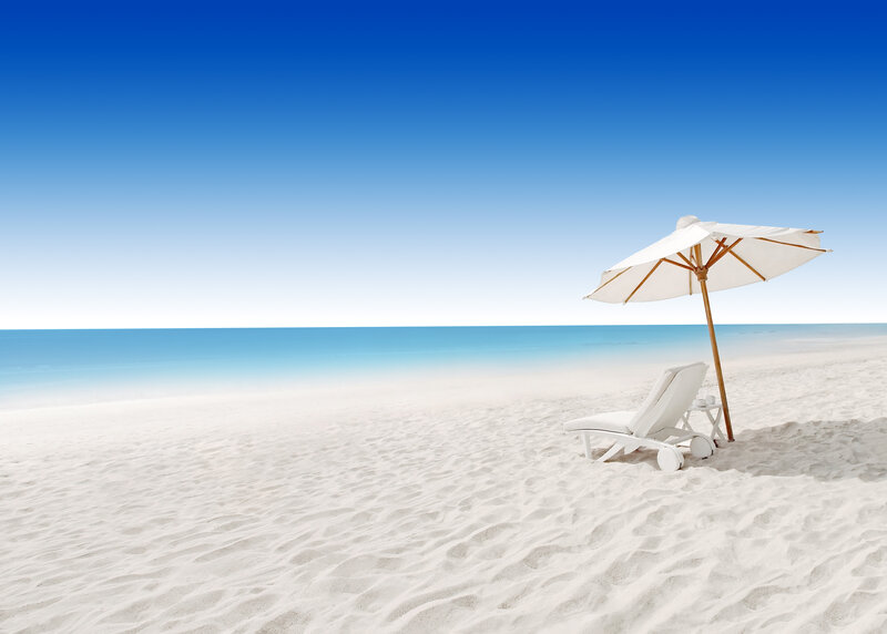 White Lounge Chair on Beach