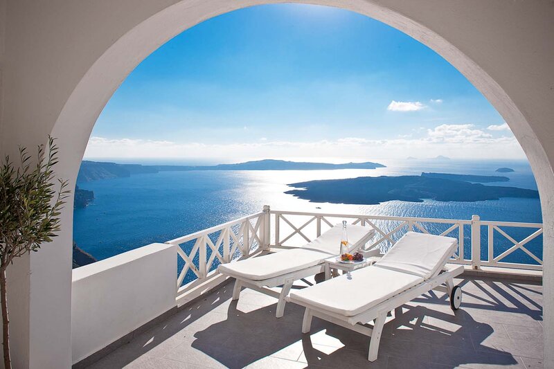 White Lounge Chairs on Balcony