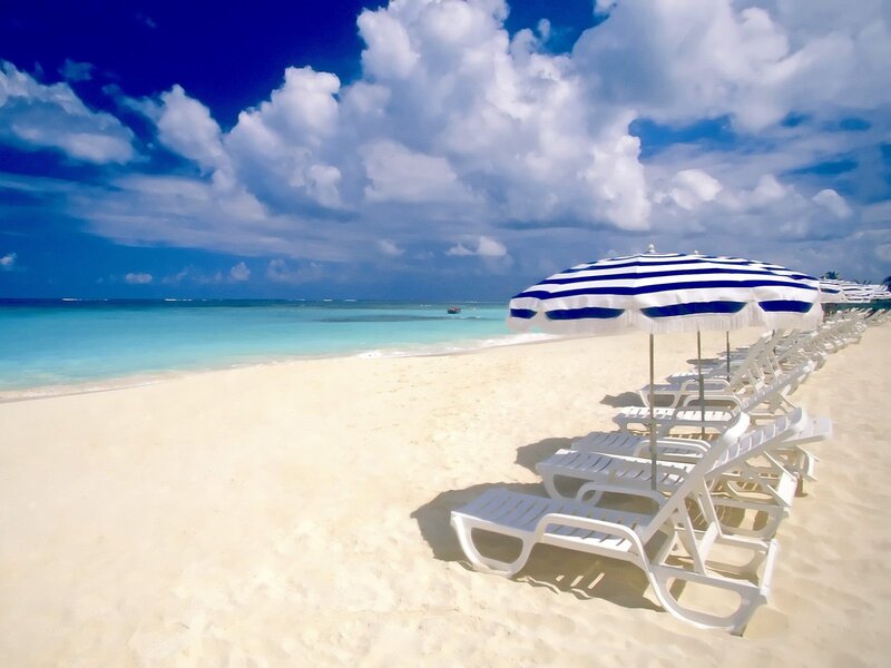 White Lounge Chairs on Beach — Blue, Serene, Afternoon, Photograph, Umbrellas