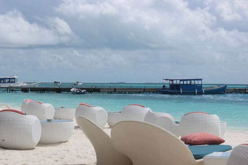 White Lounge Chairs on Beach — Serene