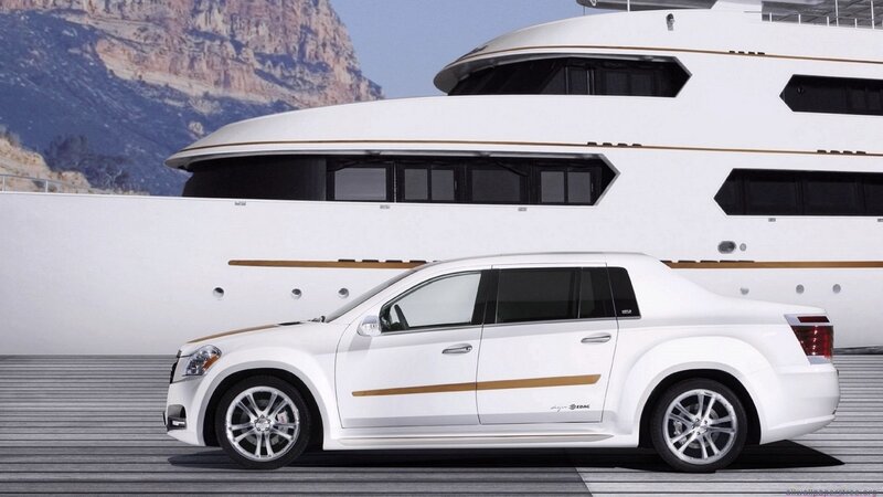 white luxury car and yacht