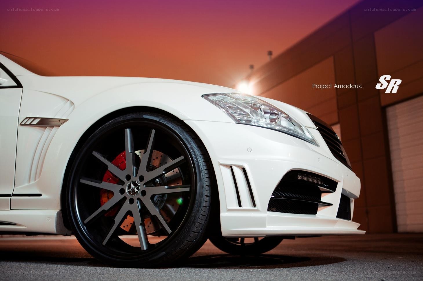 white luxury car at sunset