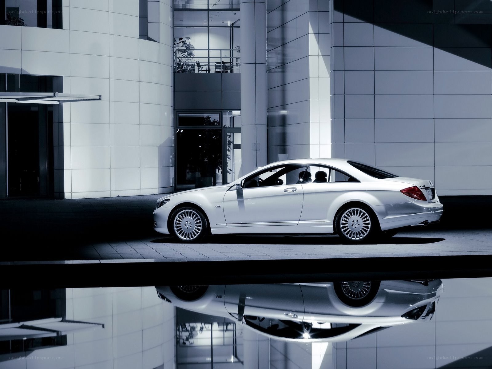 White luxury car in modern setting