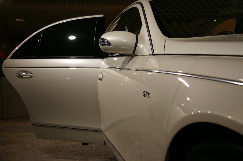 White luxury car with open door