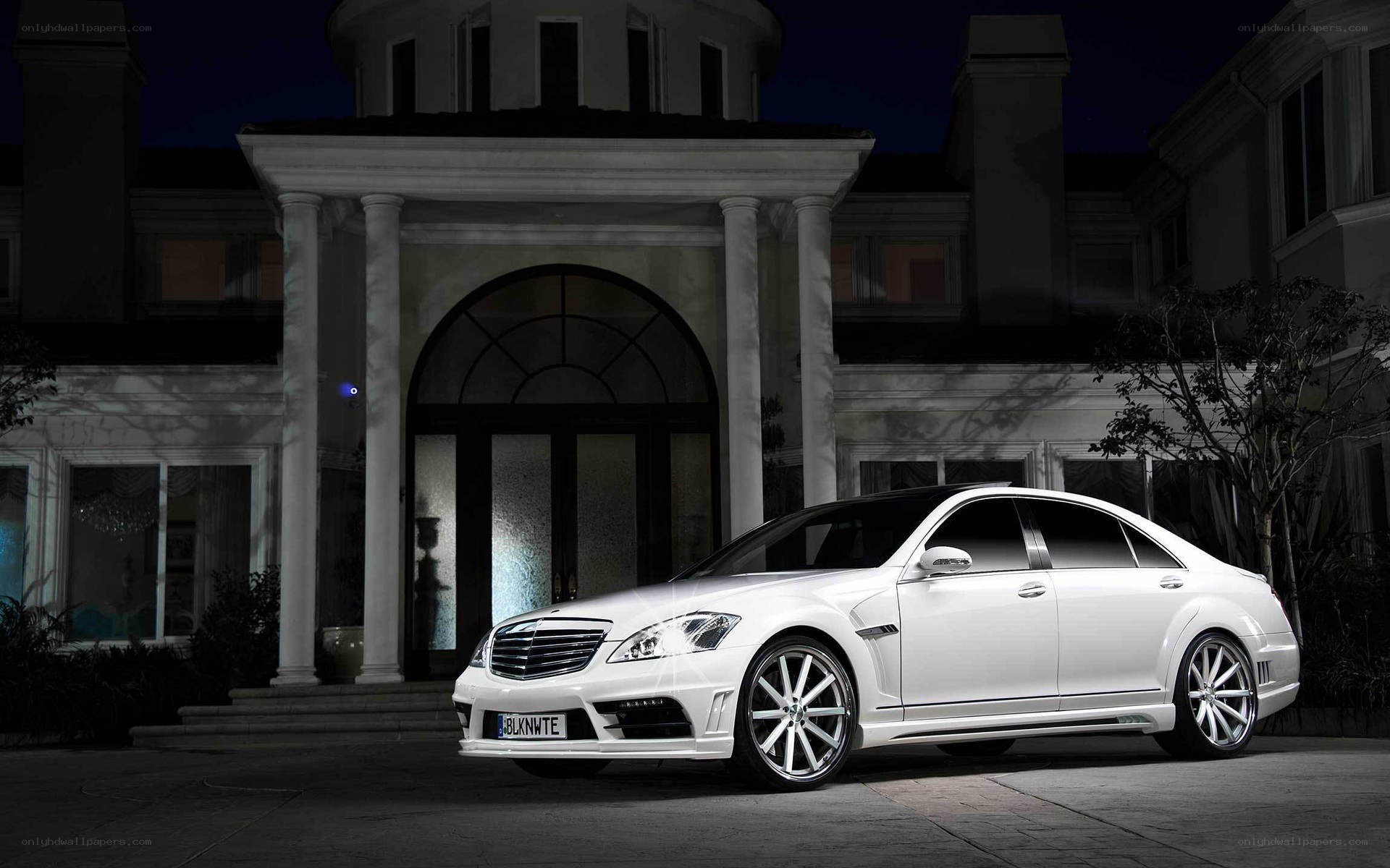 White luxury sedan at night