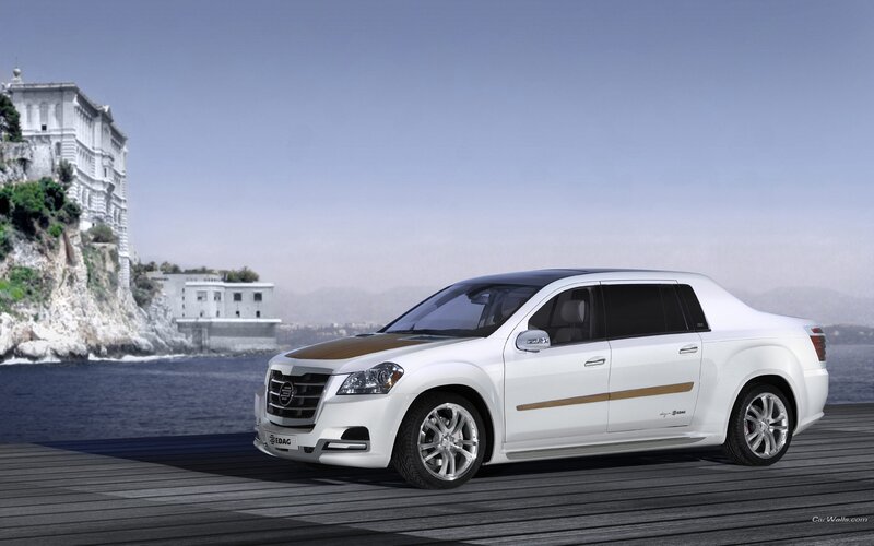 white luxury sedan by the sea
