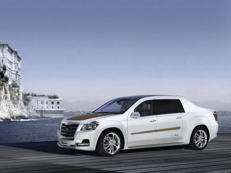 White luxury sedan by the sea
