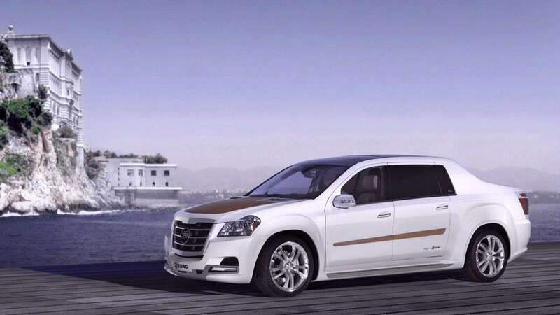 White luxury sedan by the sea