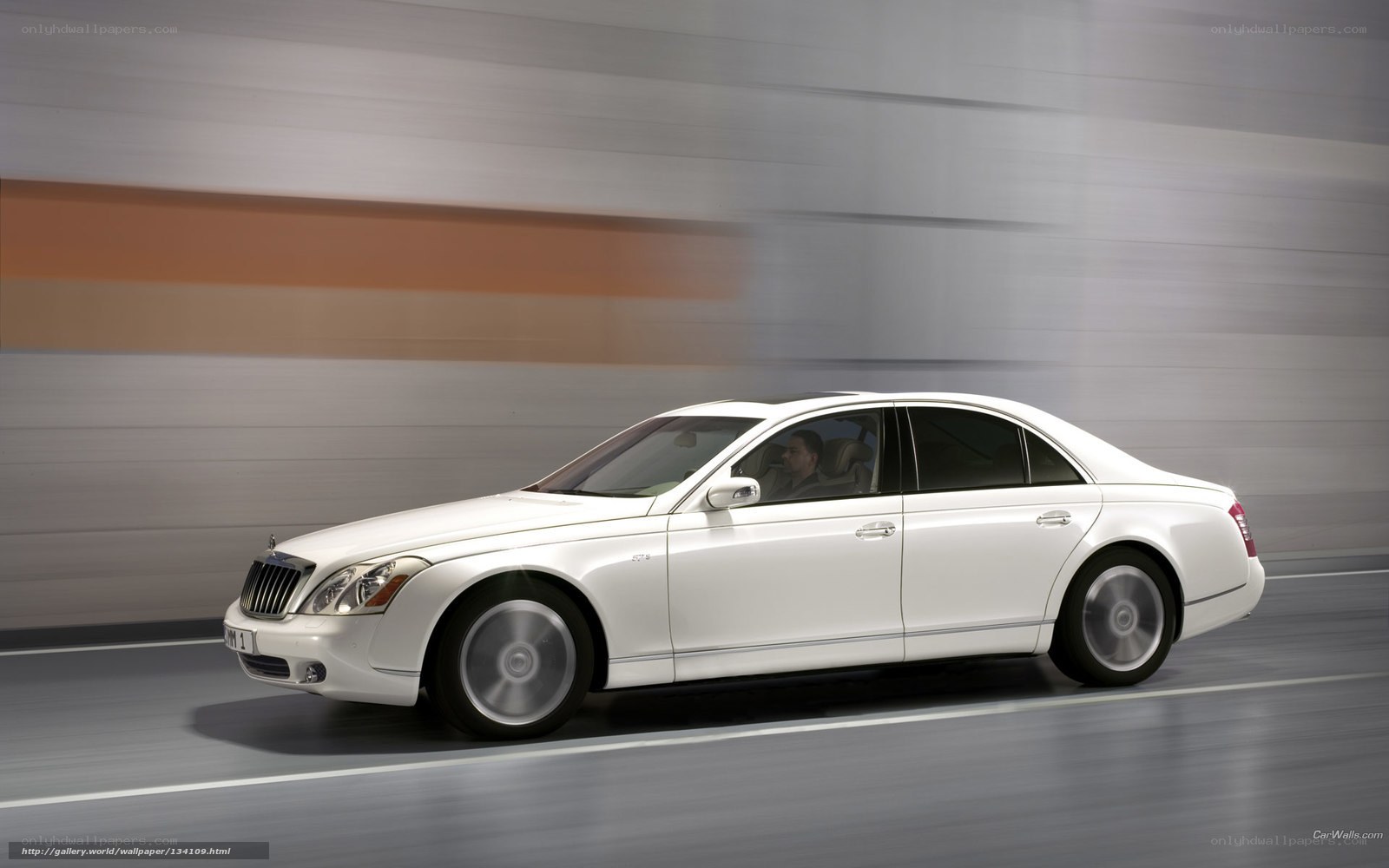 white luxury sedan in motion
