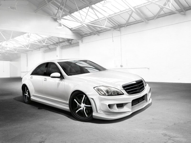 White luxury sedan in warehouse
