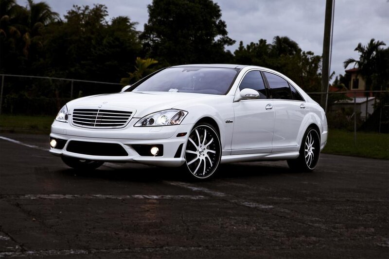 white luxury sedan on asphalt