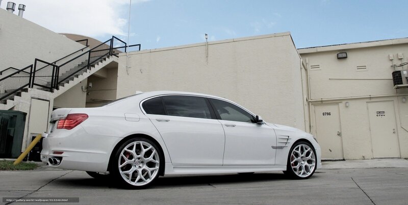 white luxury sedan parked