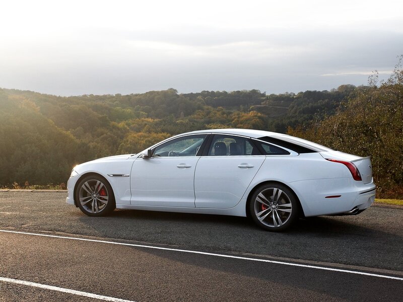 White Luxury Sedan — Serene, Sunset