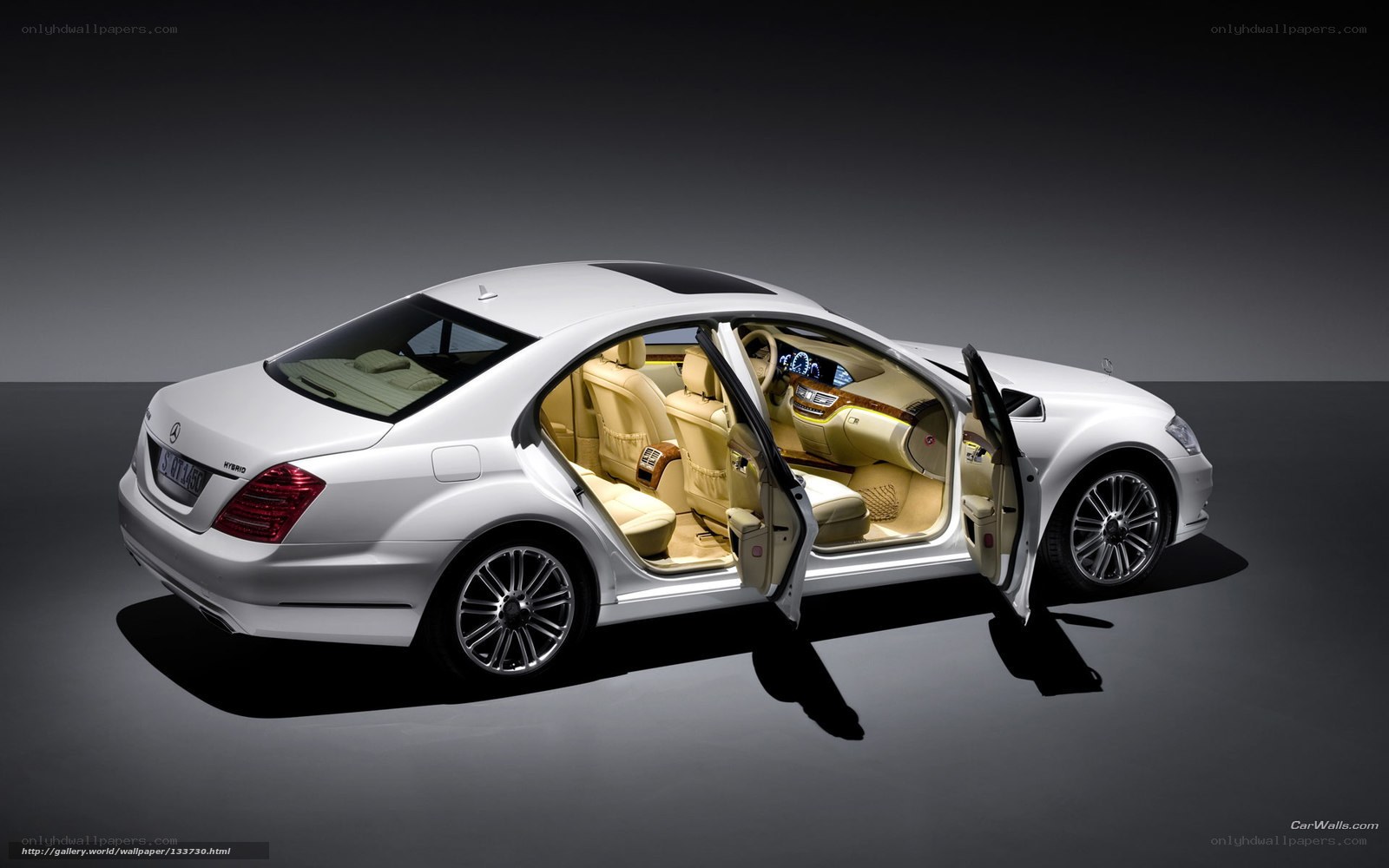 White luxury sedan with open doors