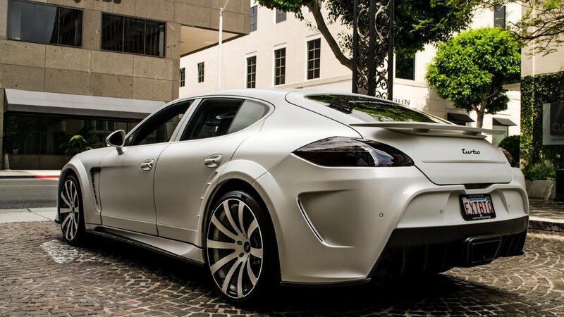 white luxury sports car on cobblestone