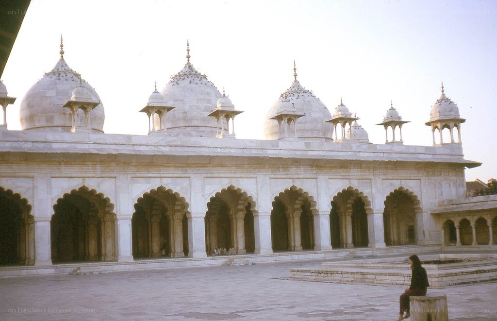 white marble mosque with domes