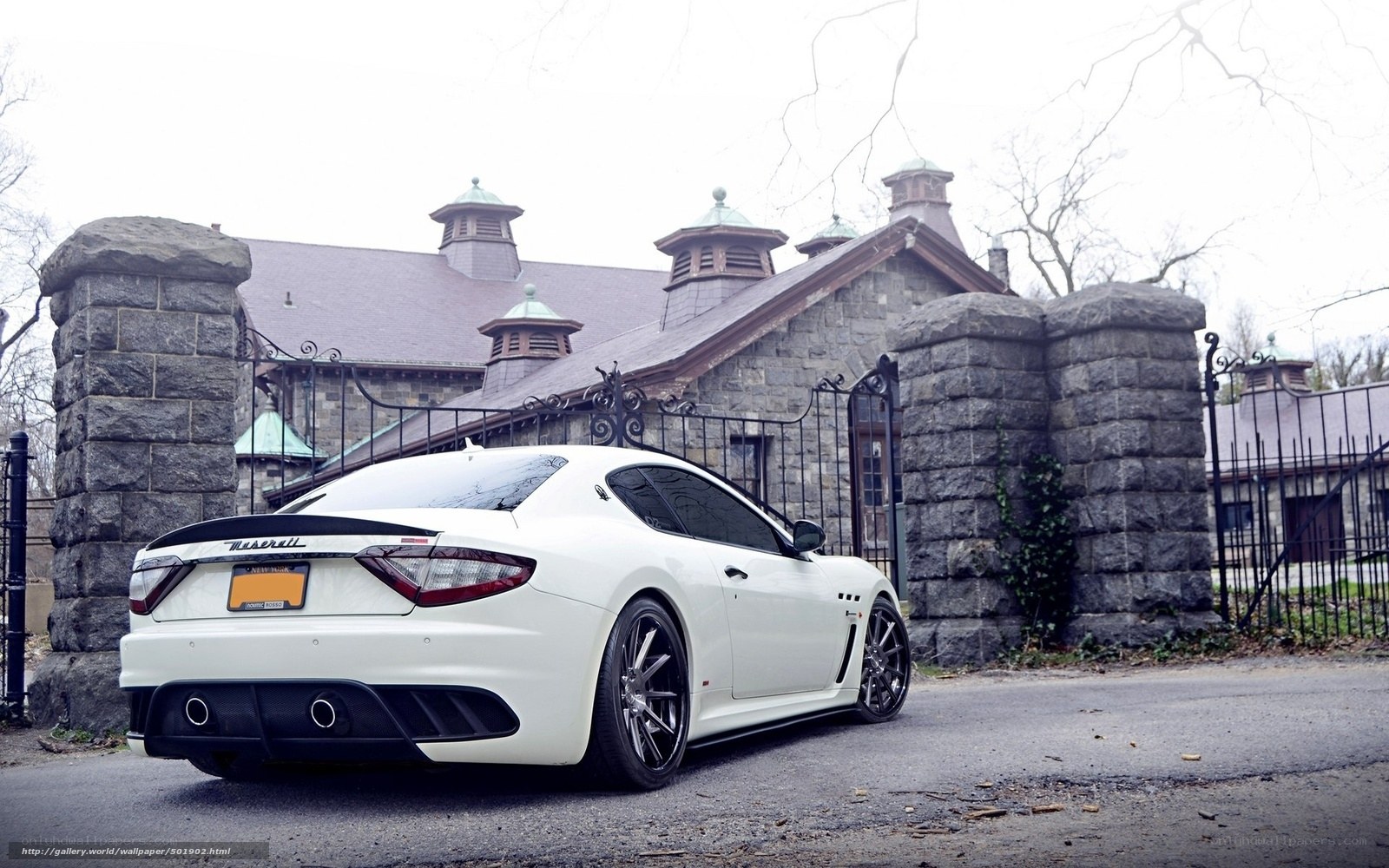 White Maserati at stone gate