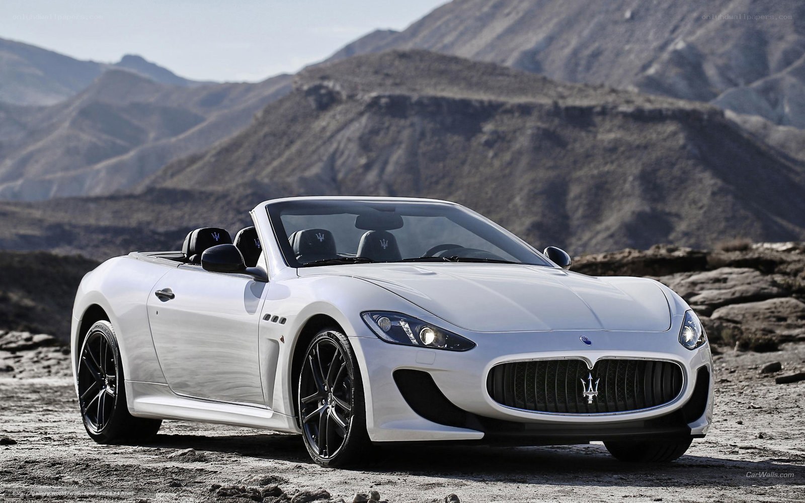 White Maserati convertible in desert