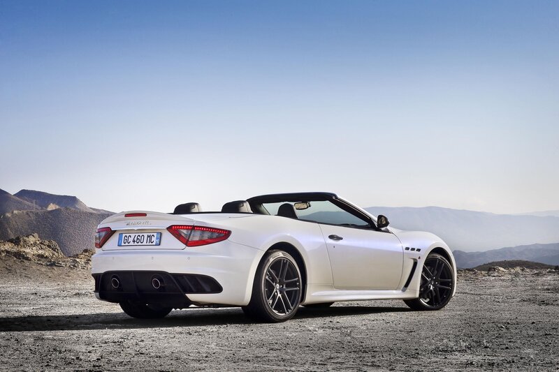 White Maserati convertible on mountain road