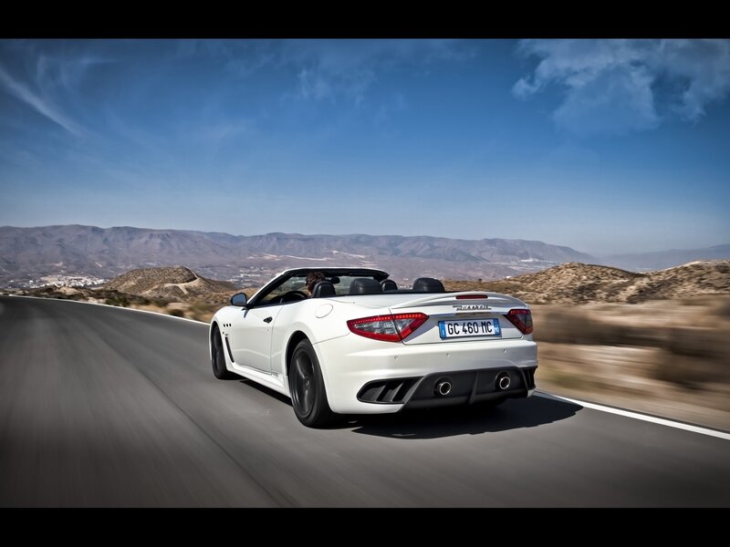 White Maserati convertible on road