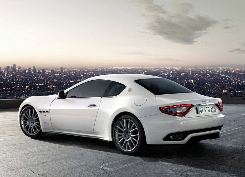 White Maserati GT on city overlook