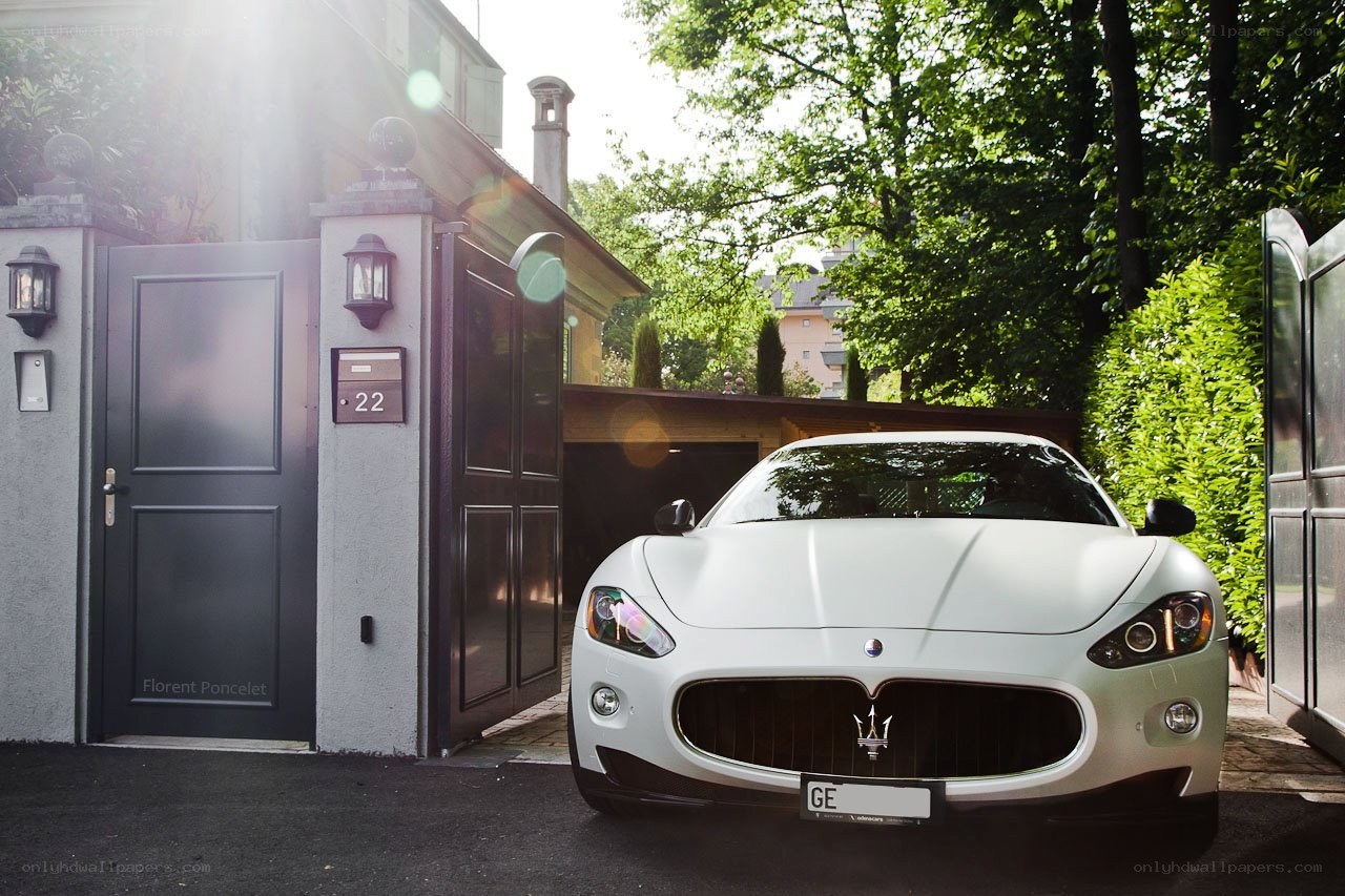 White Maserati in driveway