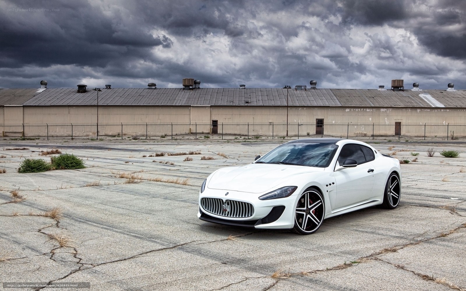 White Maserati in empty lot