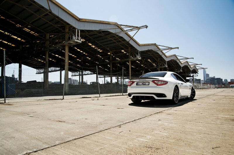 White Maserati in industrial lot