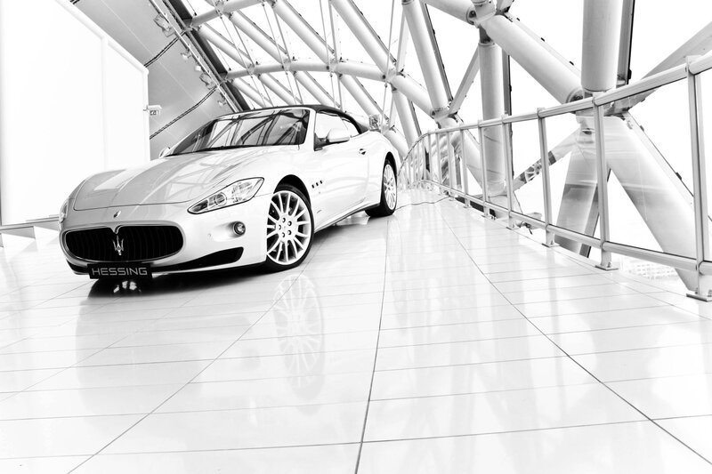 White Maserati in modern showroom