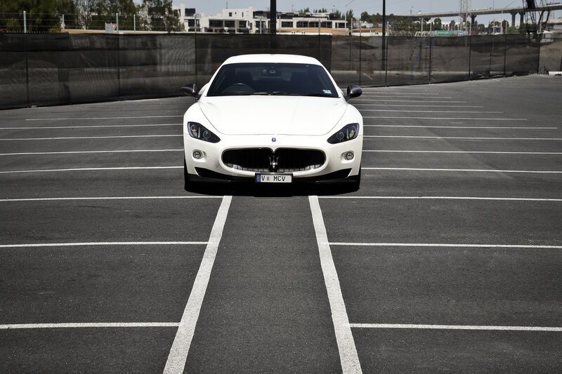 White Maserati in parking lot