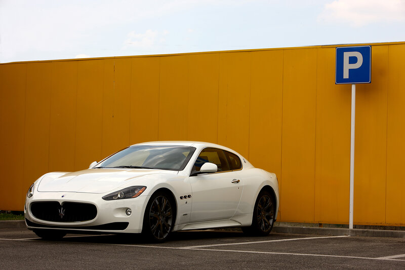 White Maserati in parking lot