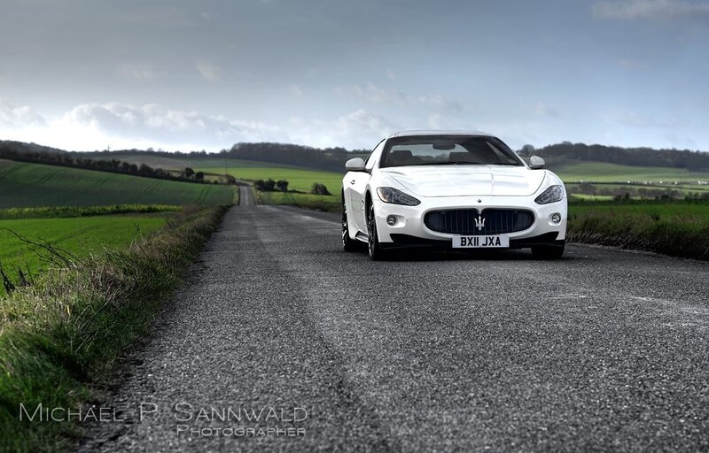 White Maserati on a country road
