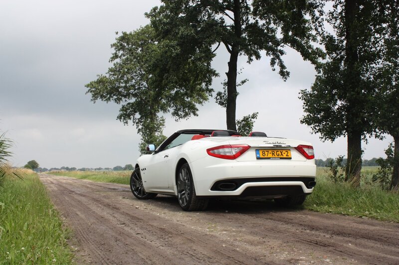 White Maserati on a country road