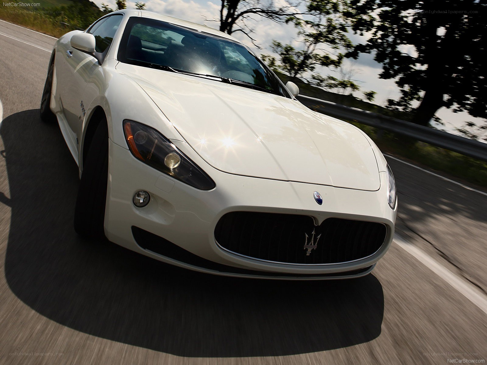 white Maserati on a road