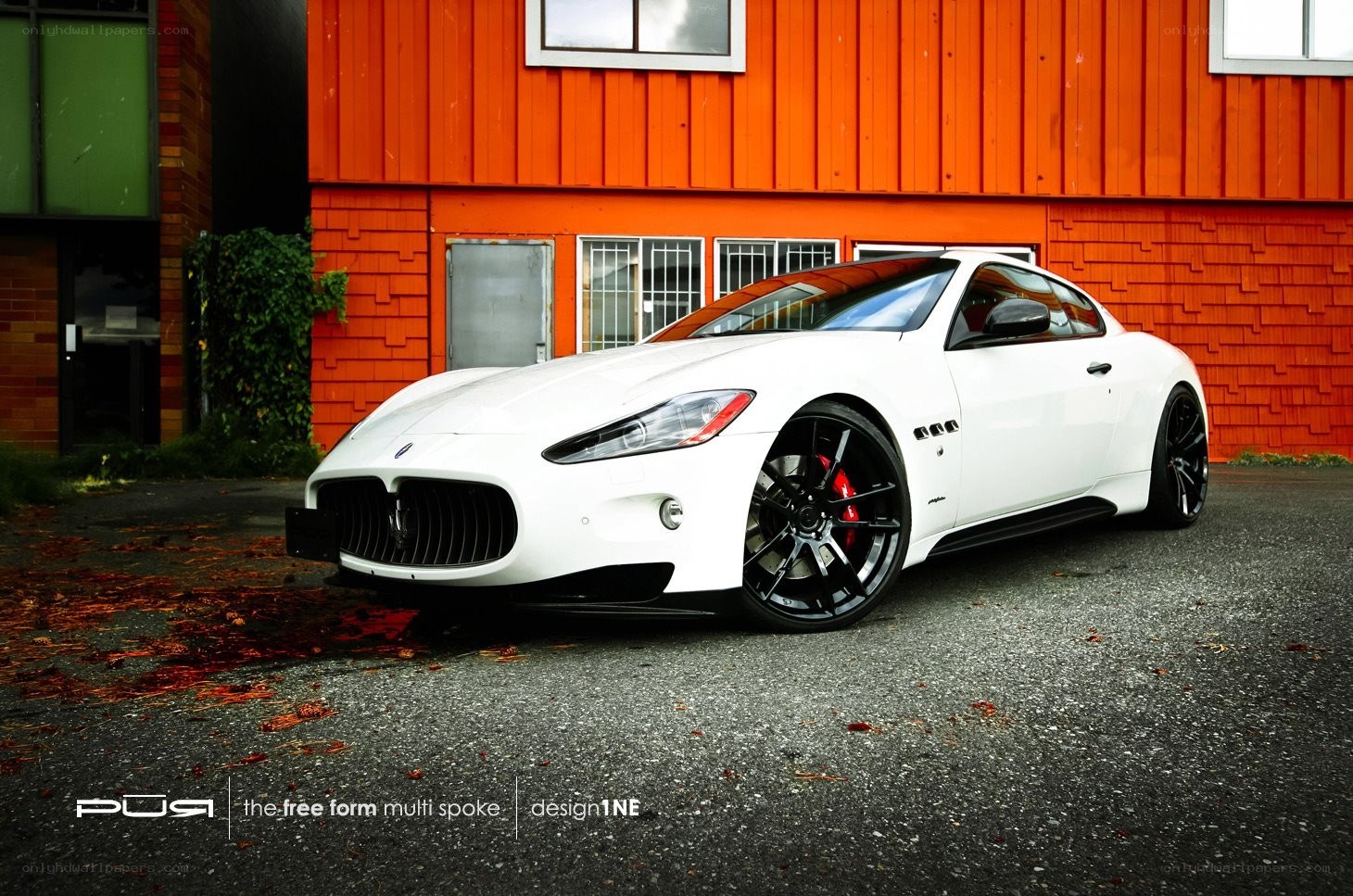 White Maserati on asphalt