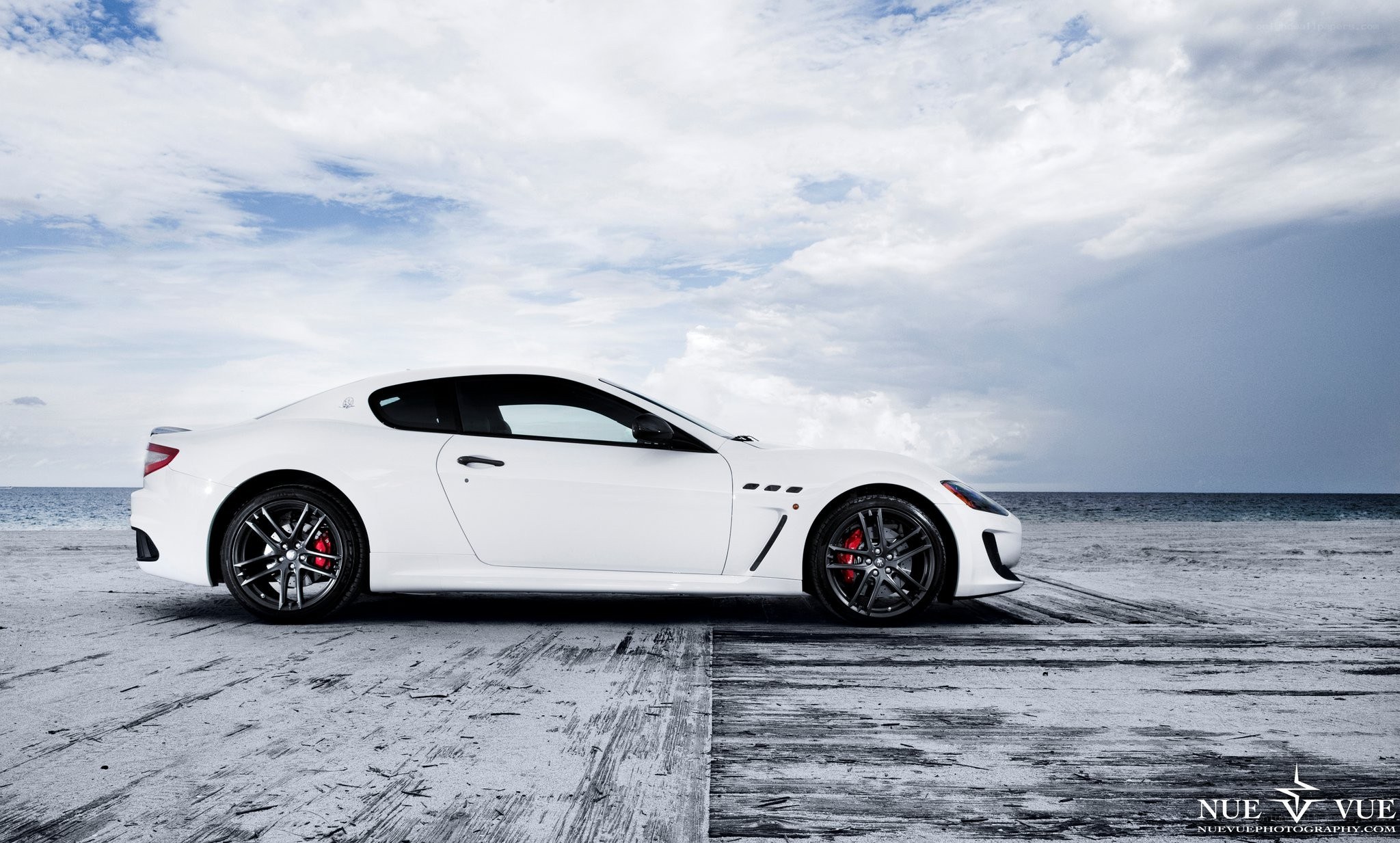 White Maserati on beach