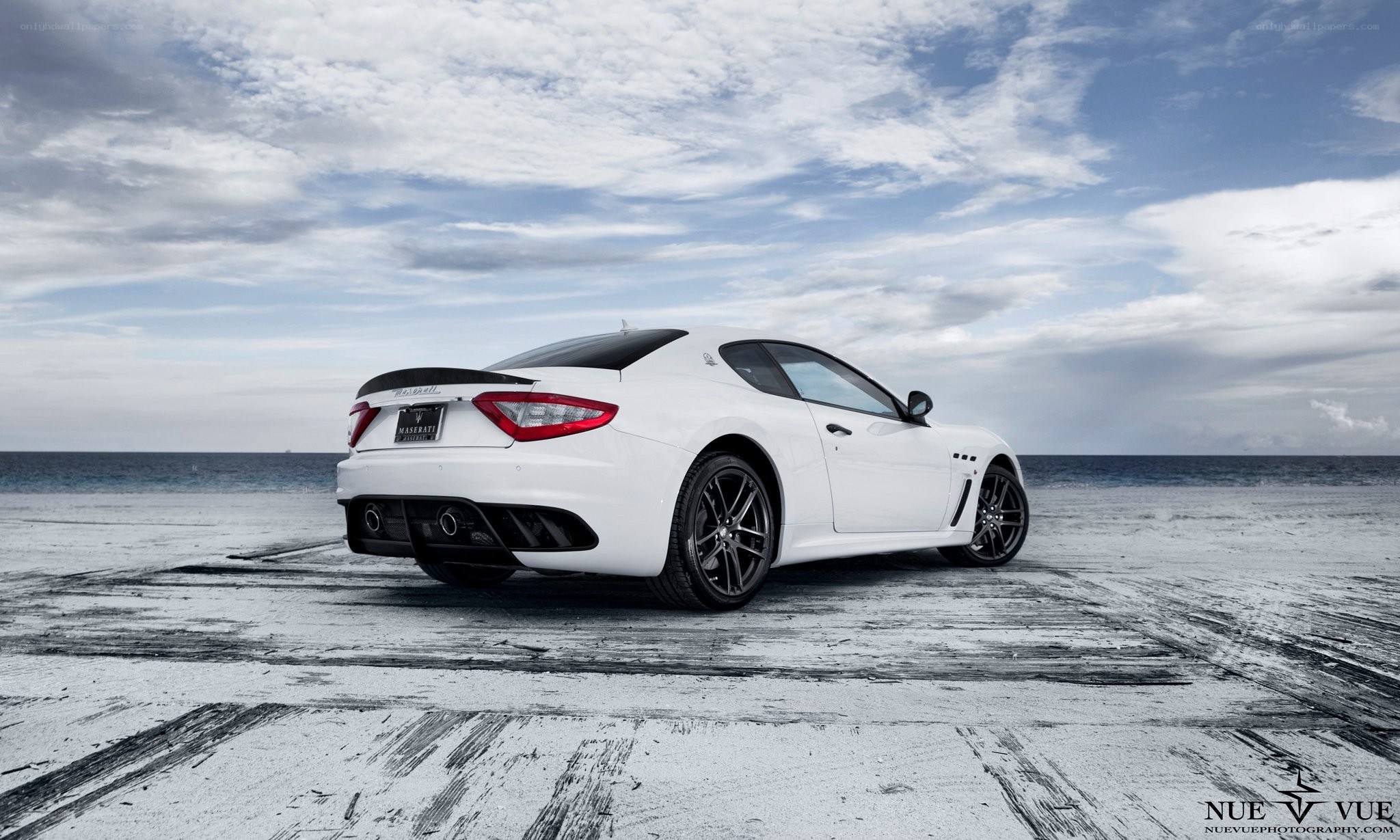 White Maserati on beach
