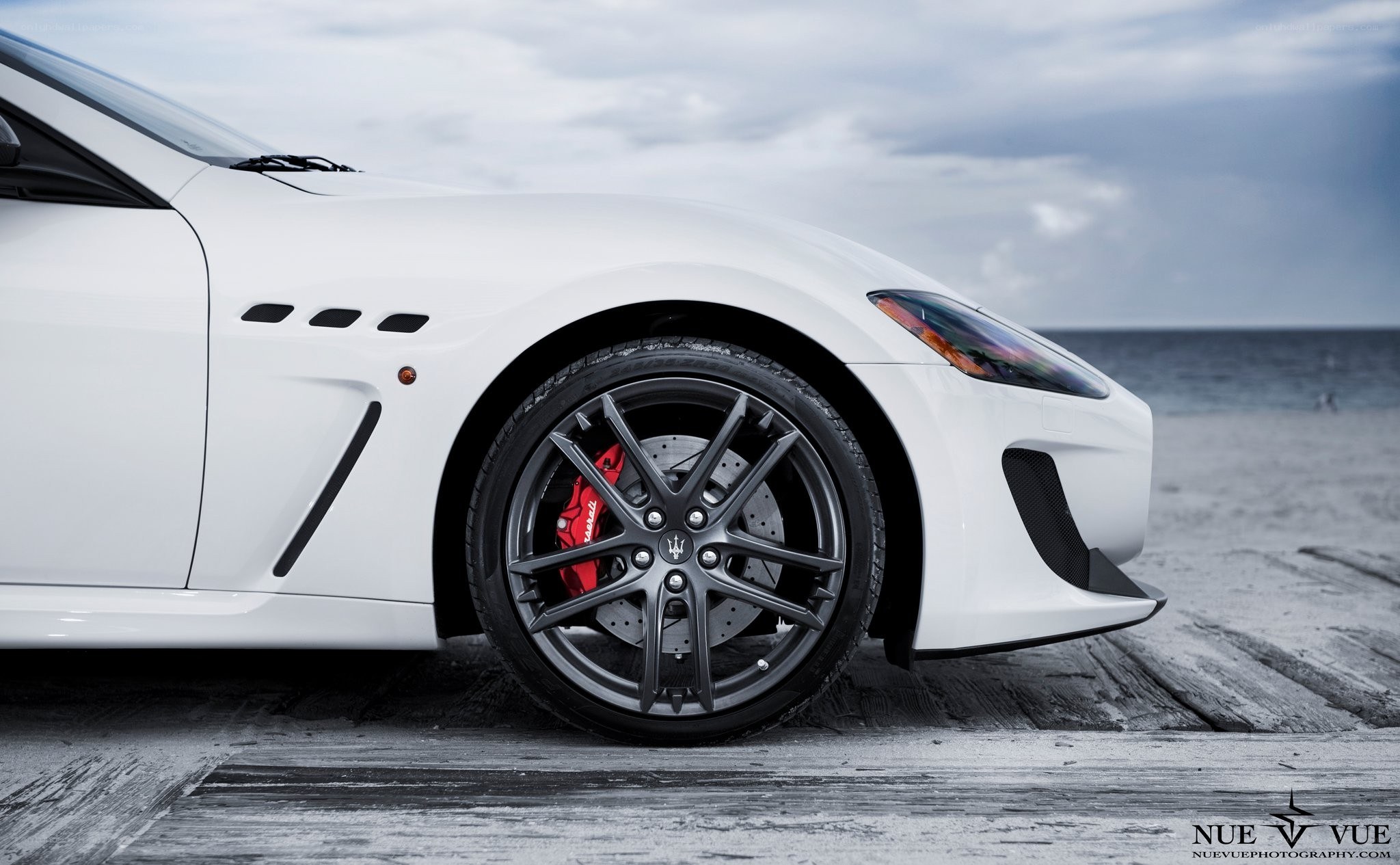 White Maserati on beach