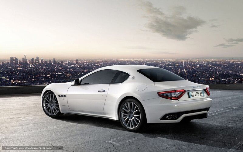 White Maserati on city overlook