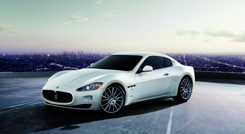 White Maserati on city overlook