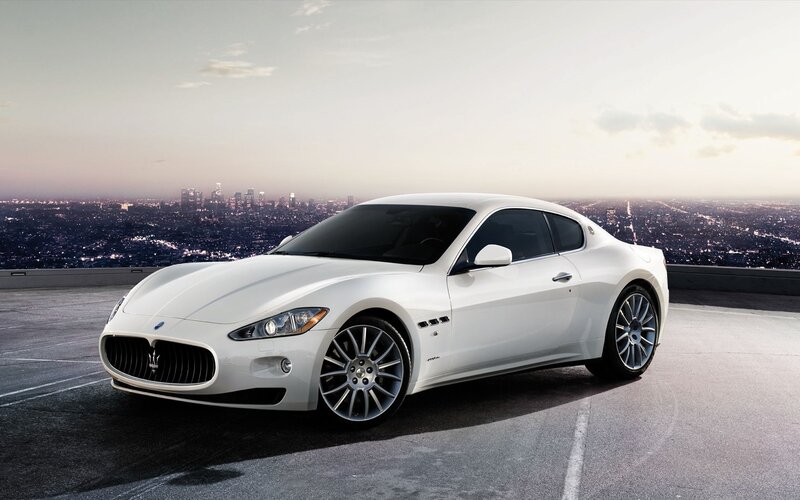 White Maserati on city overlook