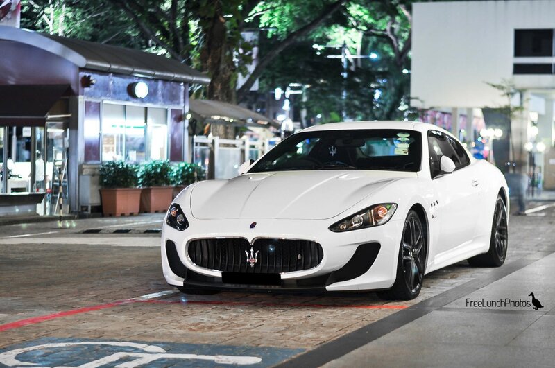 White Maserati on city street