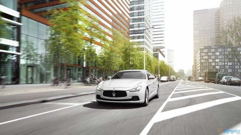 White Maserati on city street