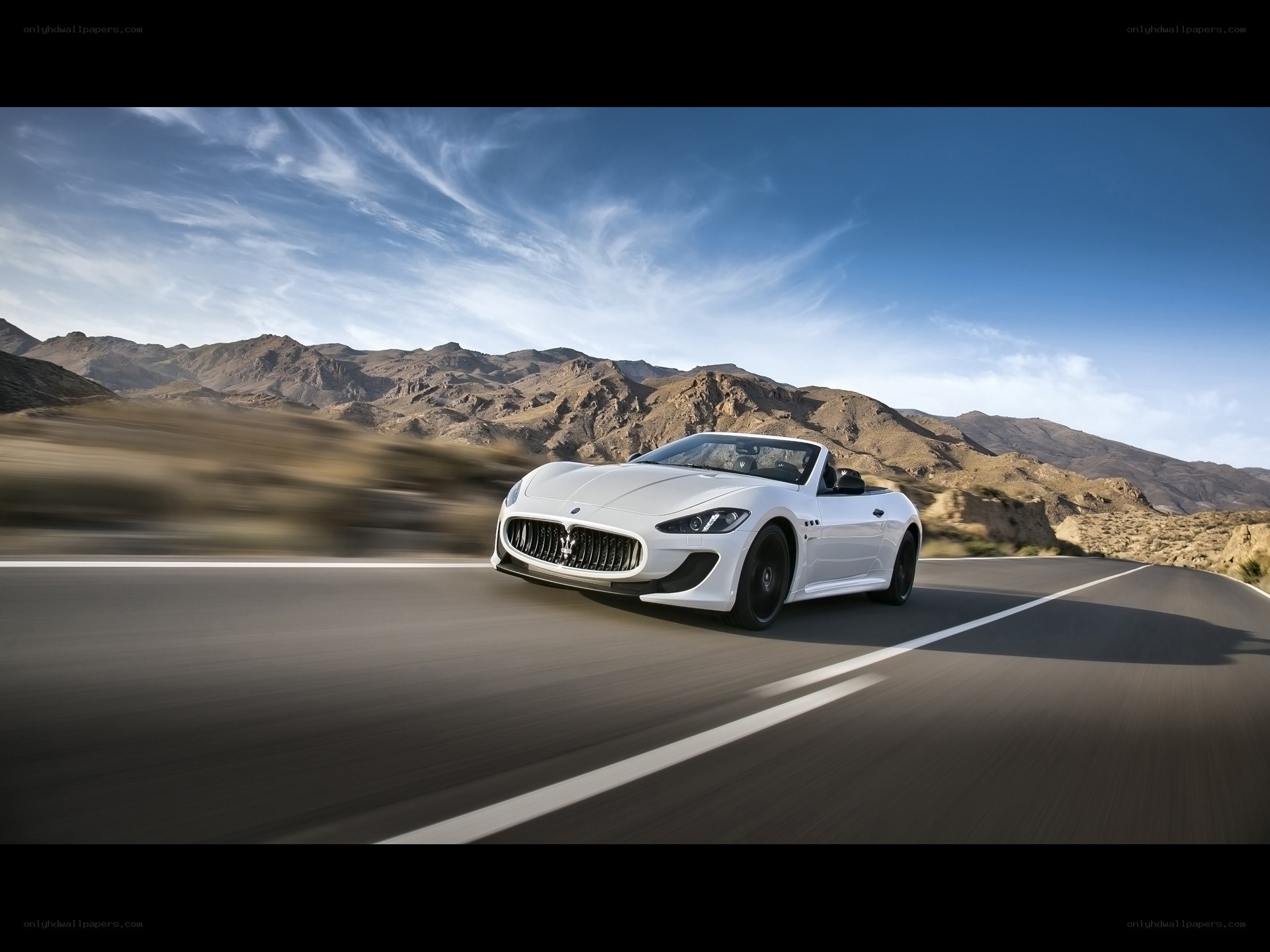 White Maserati on desert road