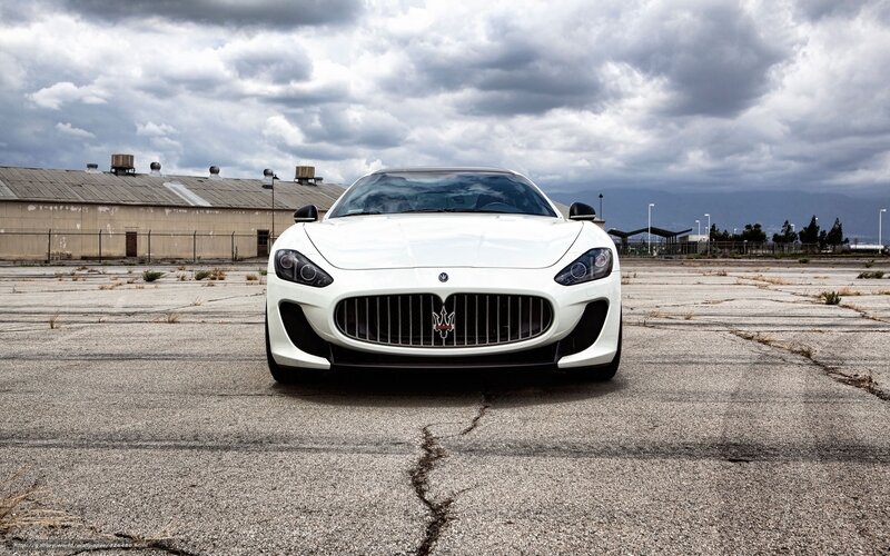 White Maserati on empty lot