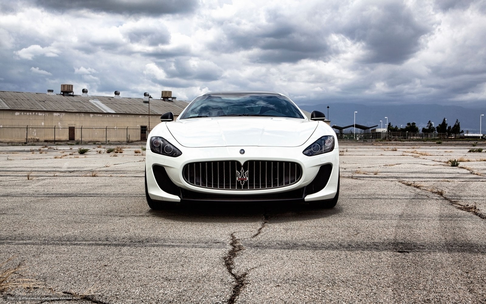 White Maserati on empty lot